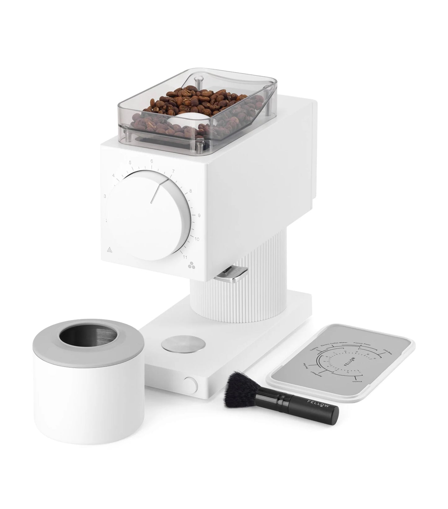 White coffee grinder with coffee beans on a white background